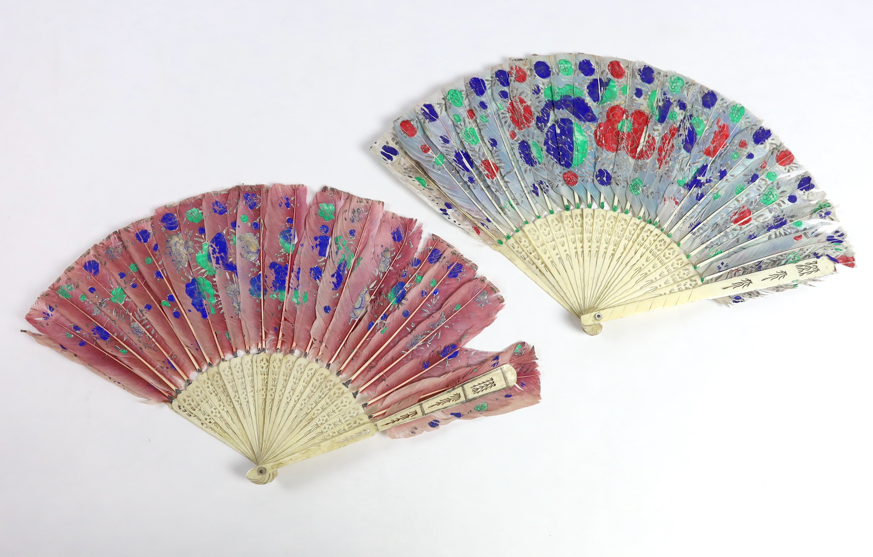 Two 19th century Chinese painted feather with bone brisé guards, one painted with a central figural cartouche, the other flowers